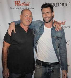 Fred Levine with his son, Adam Levine.
